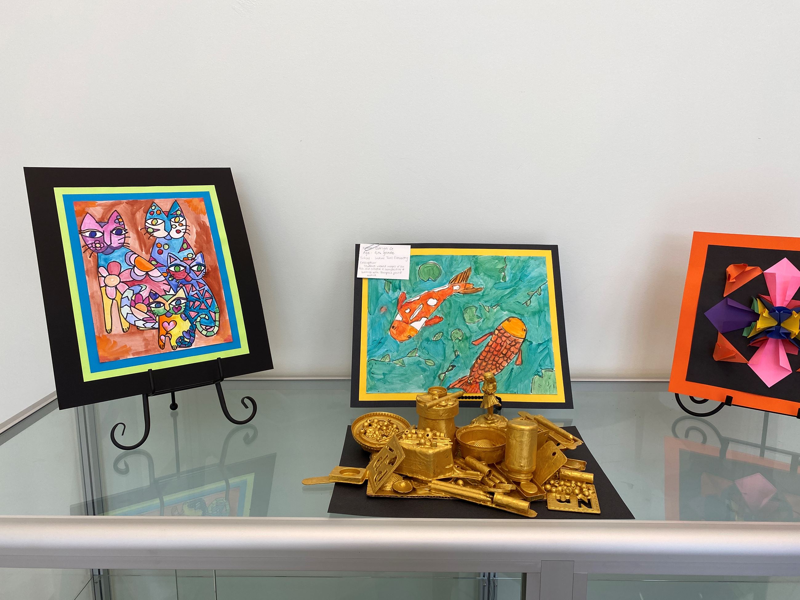 2021 Student Art Show photos on display in the lobby of Town Hall. 