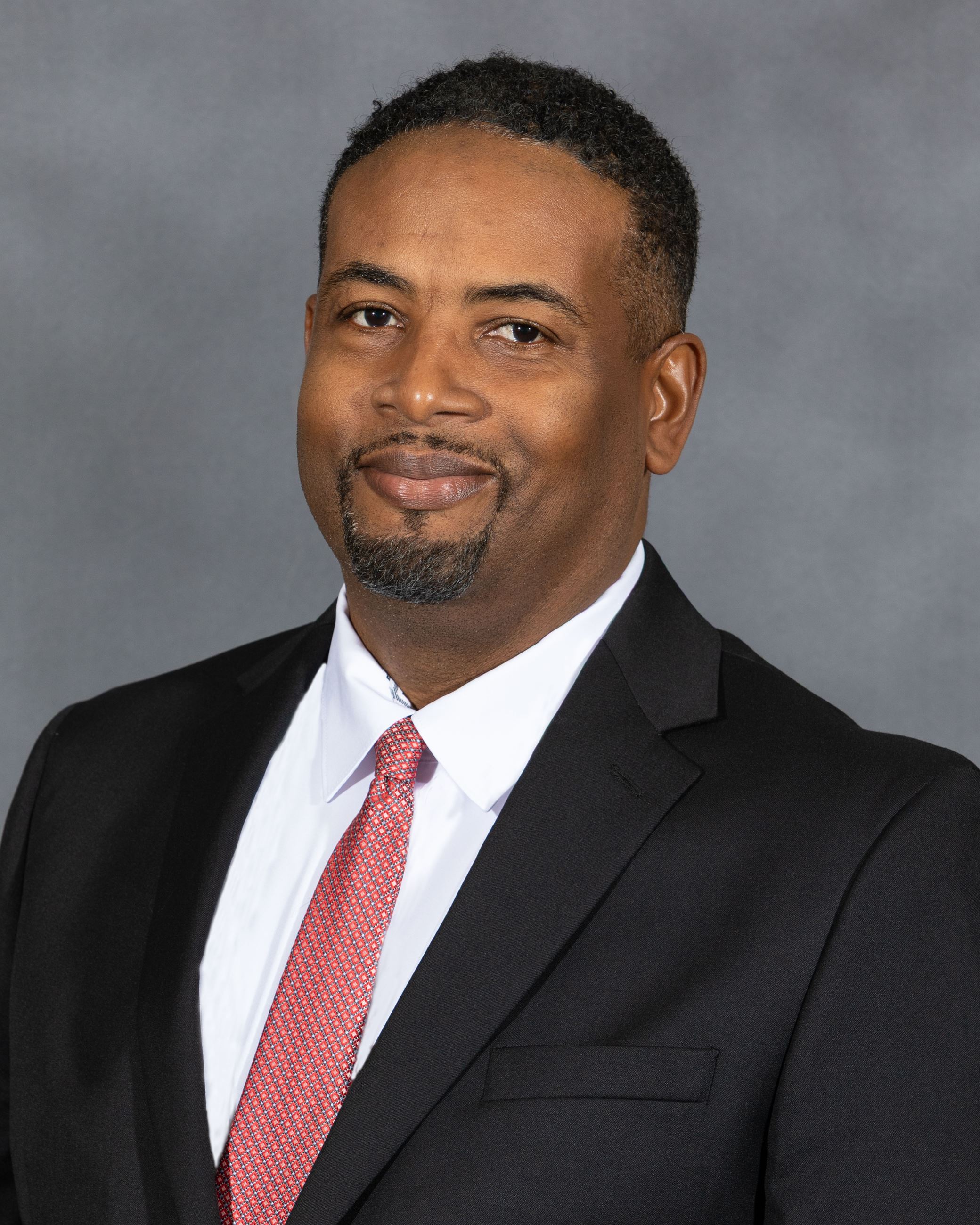 Professional headshot of Council Member Marcus McIntyre
